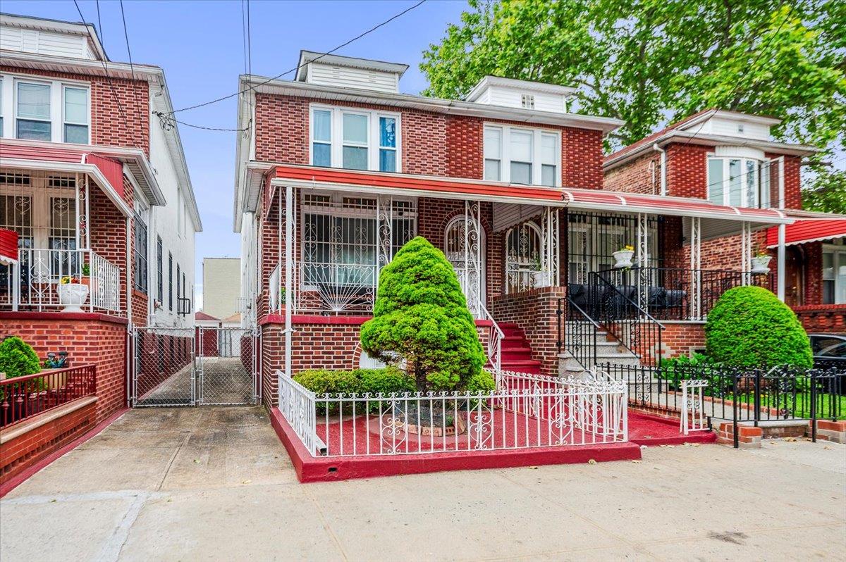 5306 Beverley Road Brooklyn, NY 11203 - Photo 1 of 22 American foursquare style home with brick siding and a gate